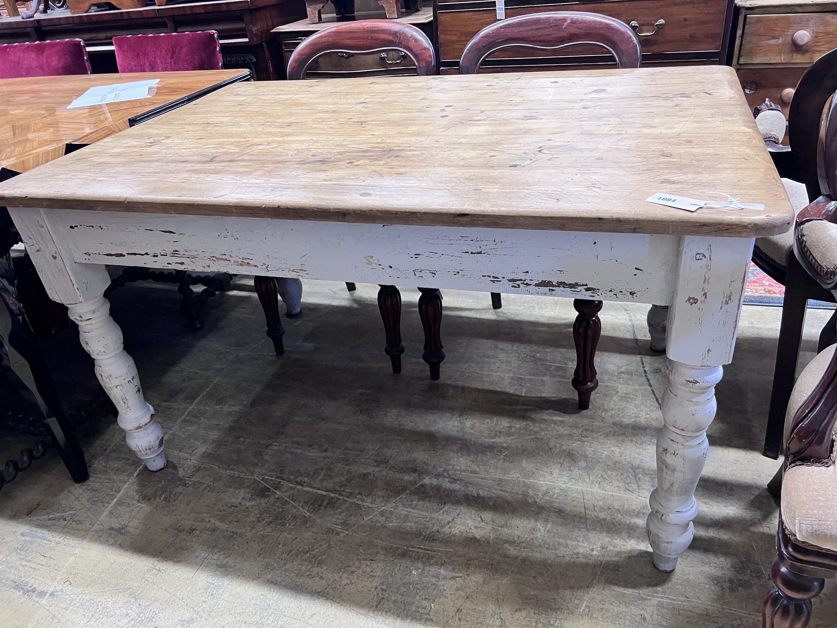 A Victorian style pine kitchen table with painted underframe, width 137cm, height 92cm